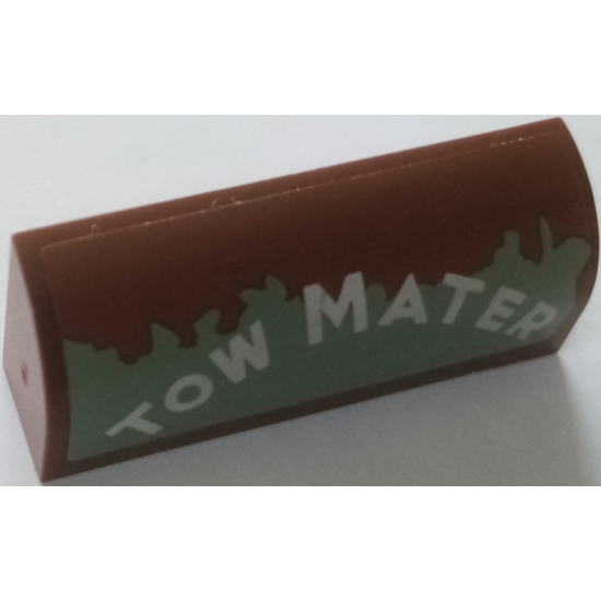 Slope, Curved 1 x 4 x 1 1/3 with White 'TOW MATER' on Worn Sand Green Background Pattern Model Left Side (Sticker) - Set 8677