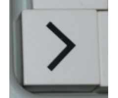 Duplo, Tile 2 x 2 x 1 with Black Less Than Sign (<) / Greater Than Sign (>) Pattern