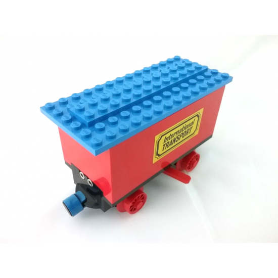 Train Battery Box Car with Two Contact Holes, Red Switch Lever, Blue and Red Magnets, Red Wheels, and Blue Roof with 'International TRANSPORT' Pattern on Both Sides (Stickers)