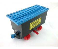 Train Battery Box Car with Two Contact Holes, Red Switch Lever, Blue and Red Magnets, Red Wheels, and Blue Roof with 'International TRANSPORT' Pattern on Both Sides (Stickers)