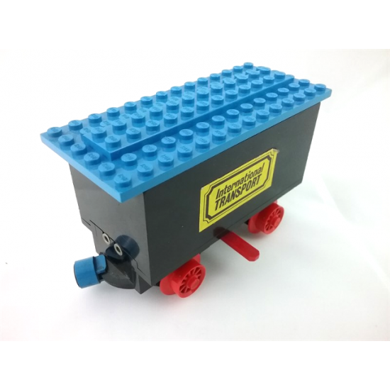 Train Battery Box Car with Two Contact Holes, Red Switch Lever, Blue and Red Magnets, Red Wheels, and Blue Roof with 'International TRANSPORT' Pattern on Both Sides (Stickers)
