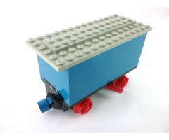 Train Battery Box Car with Two Contact Holes, Red Switch Lever, Blue and Red Magnets, Red Wheels, and Light Gray Roof
