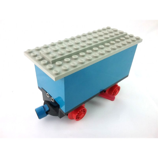 Train Battery Box Car with Two Contact Holes, Red Switch Lever, Blue and Red Magnets, Red Wheels, and Light Gray Roof