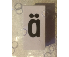Tile, Modified 1 x 2 x 5/6 with Stud Hole in End and Black 'ä' Lower Case Pattern
